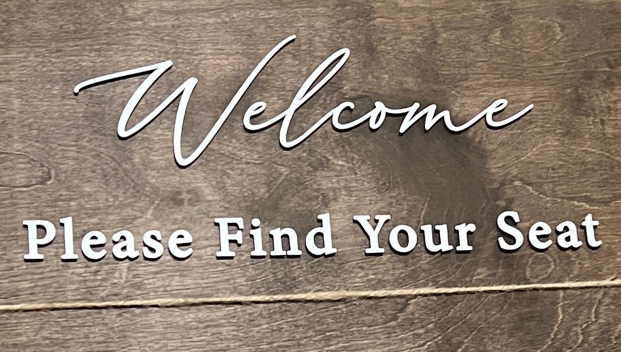 welcome please find your seat lettering on wood wedding welcome sign - Celebrating Together